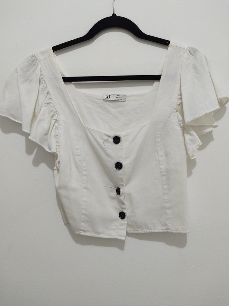 Blusa  manga corta blanca con botones negros
